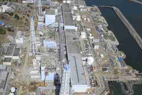 In this March 24, 2011 aerial photo taken by small unmanned drone and released by AIR PHOTO SERVICE, the crippled Fukushima Dai-ichi nuclear power plant is seen in Okumamachi, Fukushima prefecture, northern Japan. From top to bottom, Unit 1 through Unit 4.(Air Photo Service Co. Ltd., Japan)